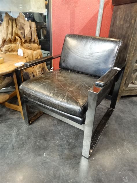 A stylish variation of our texas armchair, but without armrests. Modern Leather Chair has a masculine flair with a metal frame.