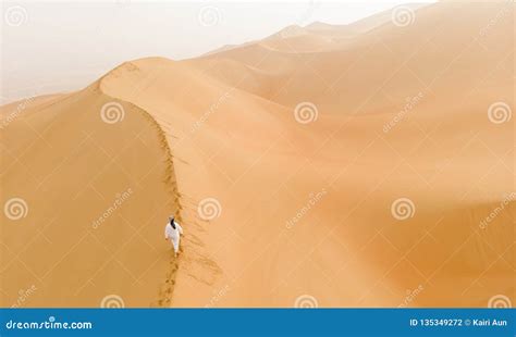 Arab Man Walking In A Desert Stock Photo Image Of Camel East 135349272