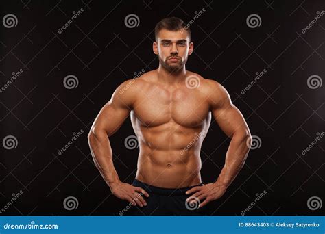 Strong Athletic Man Fitness Model Showing His Torso With Six Pack Abs