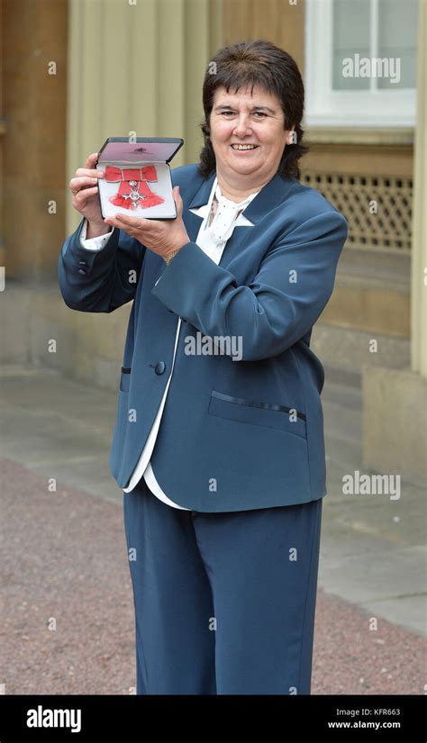 Former Wales Football International Michele Adams Holds The Mbe Presented To Her By The Duke Of