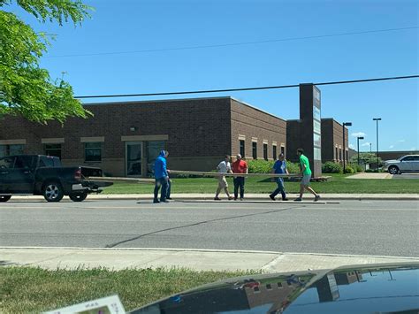 Someone lost their load of lumber on a busy road exiting a Menards