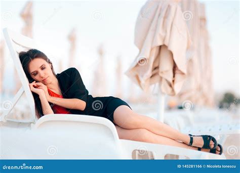 Woman Relaxing On Lounge Chair At The Beach Stock Photo Image Of
