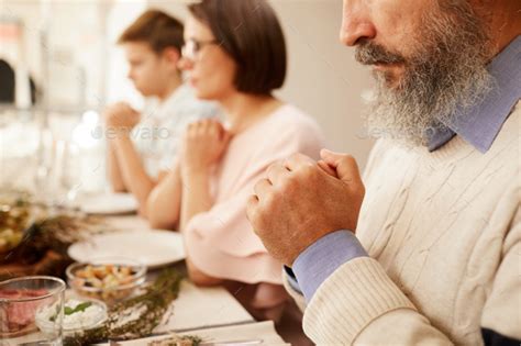 Man Praying Before Dinner Stock Photo By Annastills Photodune