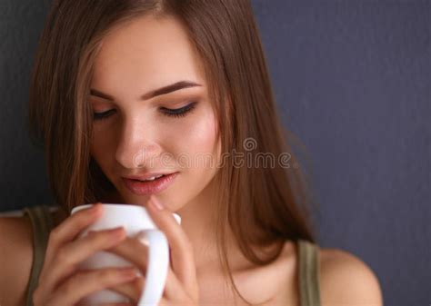 beautiful woman sitting on the floor and drinking stock image image of home beautiful 65318713