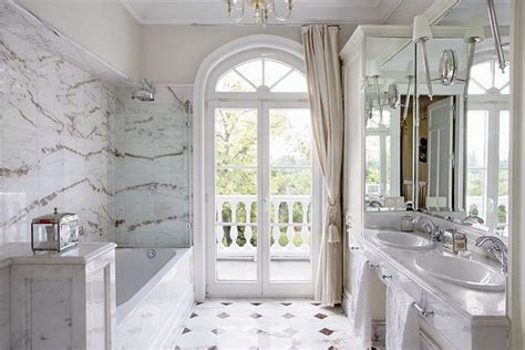 Carrara marble tile bathroom walls offer a perfect white backdrop in which you can add details like silvery faucets, flower vases or candelabras when having romantic moments with your spouse. carrara marble bathroom | Classic bathroom, Marble ...