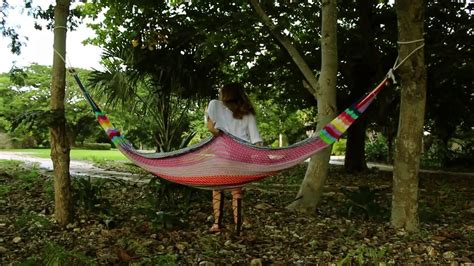 You can hang a swing using two nearby trees, especially if those trees have branches far out of reach. How To Hang Your Warimba Hammock Between Two Trees - YouTube