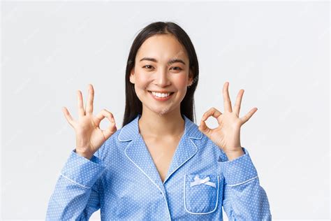Free Photo Close Up Of Satisfied Happy Asian Woman In Blue Pajama