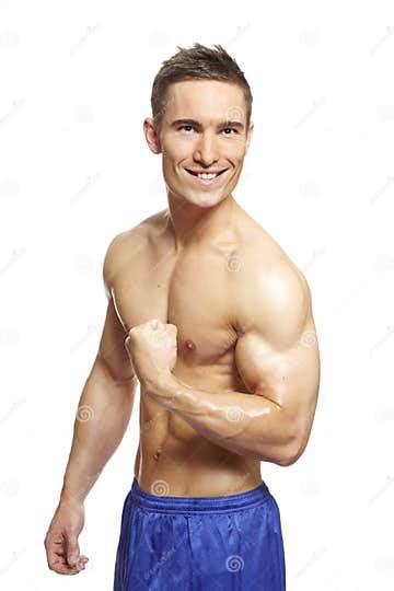 Muscular Young Man Flexing Arm In Sports Outfit Stock Photo Image Of