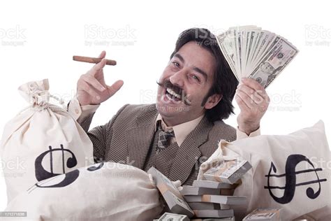 Rich Man Posing With Money Bags And Dollar Bills Stock Photo Download