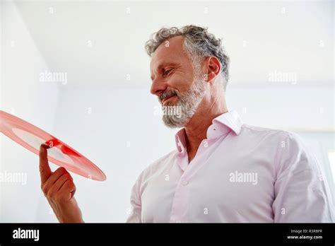 Mature Man Holding Red Vinyl Record Hi Res Stock Photography And Images