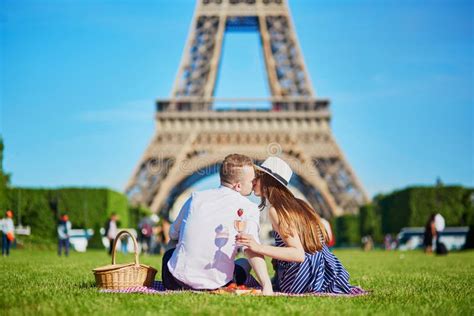 Couple Having Picnic Near The Eiffel Tower In Paris France Stock Image