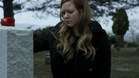 Slow Motion Somber Girl Leaving Rose On Grave Stone In Cemetery Stock