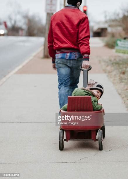 Dad Pulling Wagon Photos And Premium High Res Pictures Getty Images