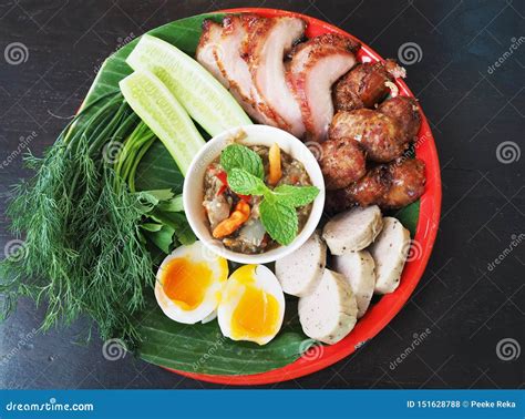 Isaan Thai Food Set With Fresh Vegetables Boiled Eggs Grilled Pork