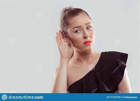Curious Worried Woman With Hand To Ear Carefully Secretly Listening To