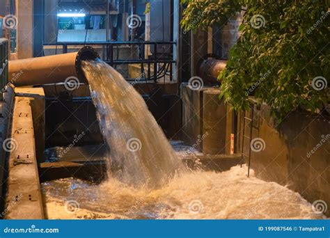 A Drain Pipe Tube Sewage Or Sewage Discharges Waste Water Into A River