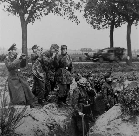Luftwaffe ground crew prepare defensive positions along a road in the