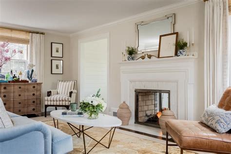 A Living Room Filled With Furniture And A Fire Place