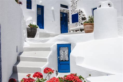 Blue Doors And White Buildings In Santorini Greece