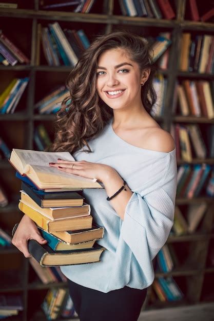 Premium Photo Young Woman Holding Books