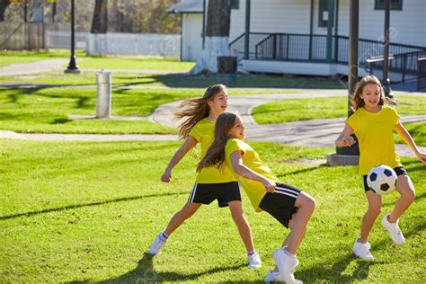 Friend Girls Teens Playing Football Soccer In A Park Turf Grass Photo