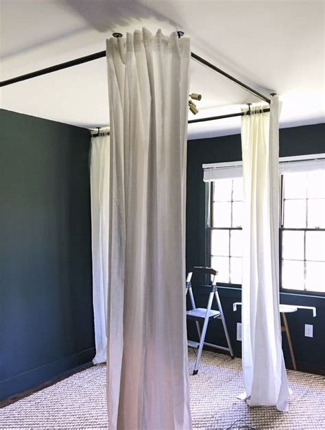 Surrounding your bed with fabric adds romance and a timeless element to your bedroom, but a canopy bed can be too pricy or impractical for many homeowners. Ceiling-hung curtain rods | Canopy bed diy, Canopy bed ...