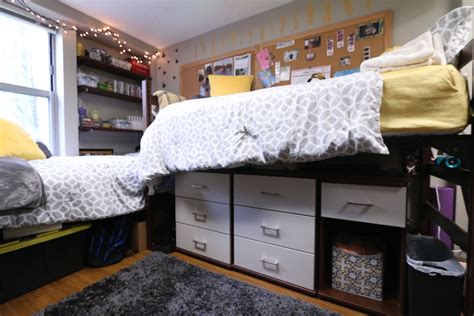 A Bedroom With Bunk Beds And Drawers In It