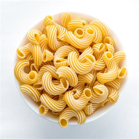 Rigati Pasta In White Bowl On White Background In The Center Close Up
