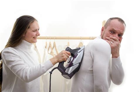 wife forces husband to iron clothes bossy wife command husband to launder in washing machine