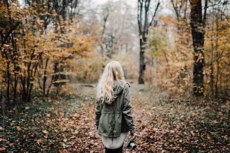 Backside View Of A Blonde Woman Walking In Forest By Boris Jovanovic