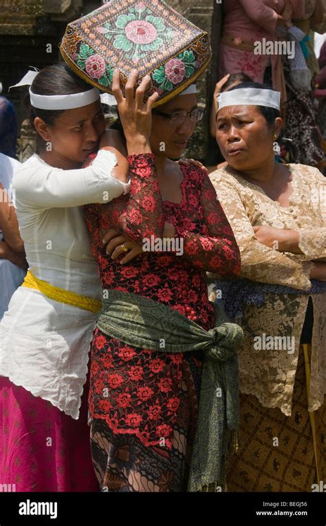 Women Grieving At A Traditional Funeral And Cremation Ceremony In Ubud