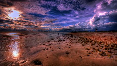 Sea Coast Beach Stone Sky With White And Dark Clouds Sunset Clouds Red