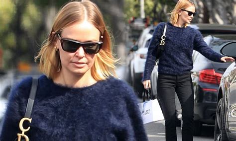 Lara Bingle Flaunts Her Slender Figure In A Furry Sweater And Tight