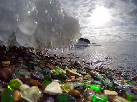 a beach on usuri bay in russia is covered with bits of glass worn down over time into smooth