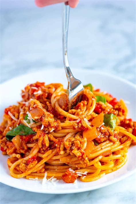 A rich, meaty spaghetti sauce that is easy to make and can be used in spaghetti, lasagna, on add crushed tomatoes, tomato paste, and marinara sauce. Easy Weeknight Spaghetti with Meat Sauce Recipe