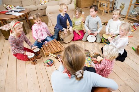 A Group Of Children Playing Musical Stock Image Colourbox