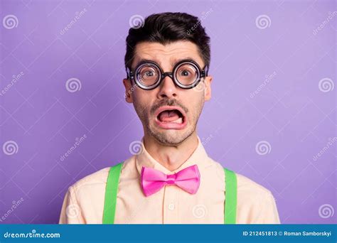 Photo Of Scared Nerd Man Wear Glasses Green Suspenders Pink Bow Tie