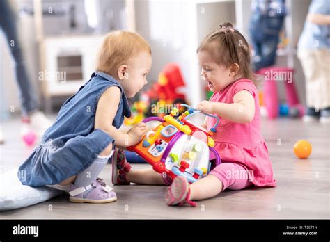 Children Fighting Over Toy Hi Res Stock Photography And Images Alamy