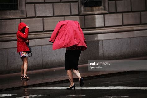 A Woman Runs For Cover During A Heavy Rain Storm In Manhattan On June News Photo Getty Images
