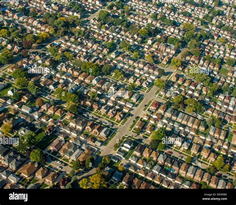 Aerial View Of Typical Suburban Neighborhood With Densely Packed Houses