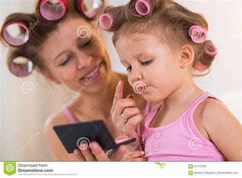 Mom And Daughter In The Bedroom On The Bed In The Curlers Make U Stock Image Image Of