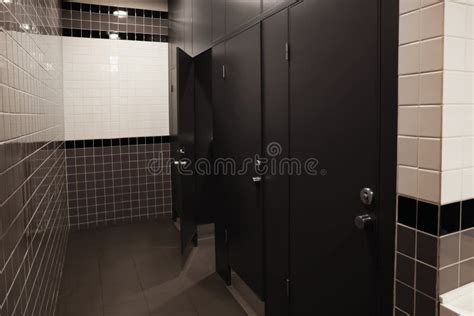 Public Toilet Interior With Stalls And Tiled Walls Stock Image Image