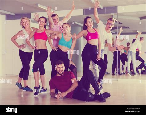 Friendly People Of Different Ages Posing In Fitness Studio Stock Photo