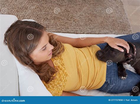Hes Never Far From My Side A Young Blonde Woman Lying On The Sofa With