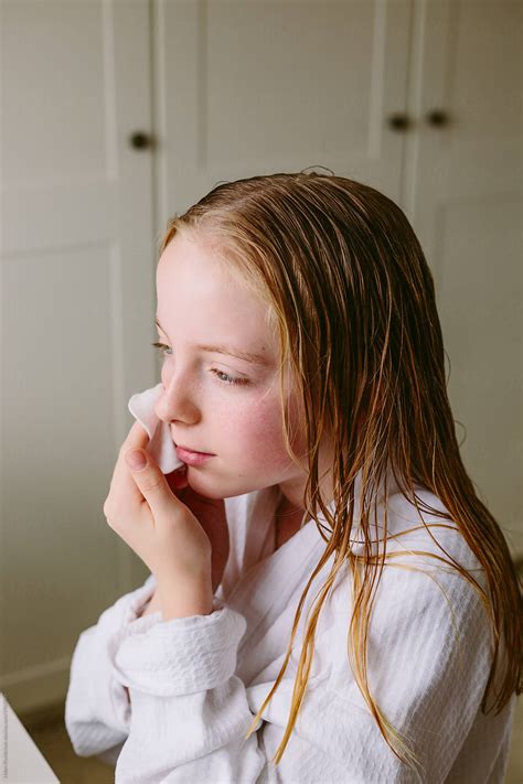 Preteen Girl Looking After Her Skin By Stocksy Contributor Helen Rushbrook Stocksy