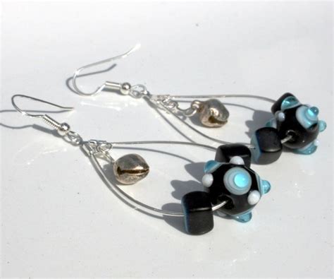 Items Similar To Teardrop Hoops Of Turquoise And Irridescent Black