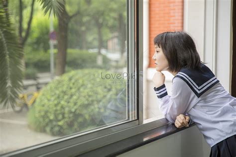 Female Students Look Out Of The Classroom Window Picture And Hd Photos