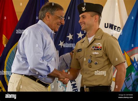 The Secdef Shakes The Hand Of A Petty Officer After Presenting Him With