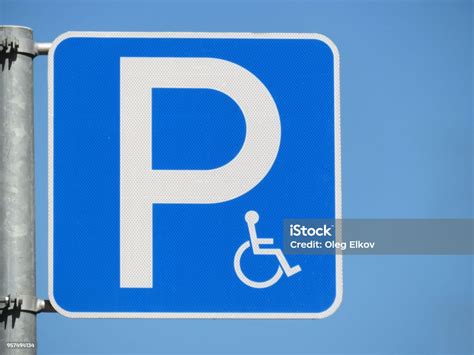 Disabled Parking Space Road Sign Isolated On Clear Blue Sky Background