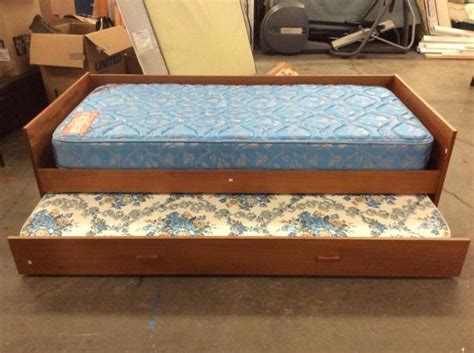 Trundle bed frames provide two twin beds in one. modern trundle bed w/ 2 mattresses, bottom pull out